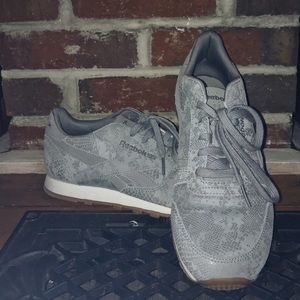 Women’s light blue snakeskin Reebok sneakers